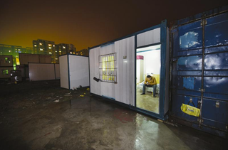 Illustration for article titled China's "Cabinet Tribe" Lives in Shipping Containers